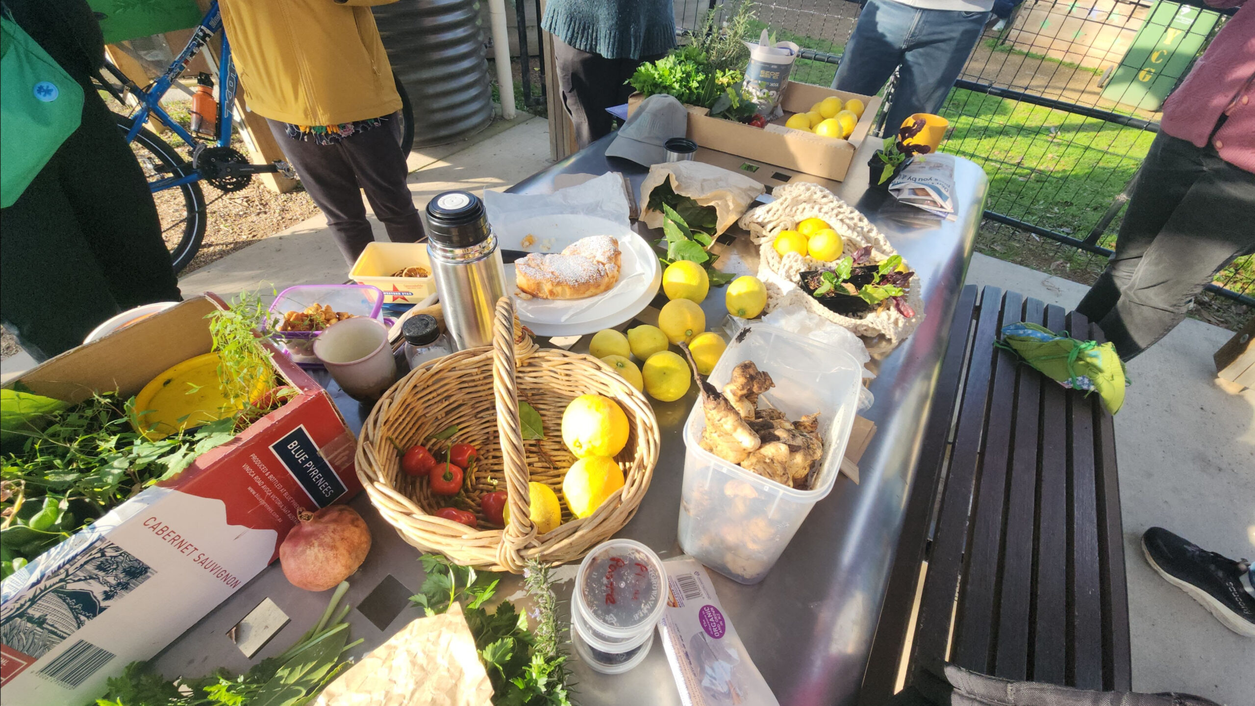 Table covered with fresh fruit, vegetables and homeamde food.